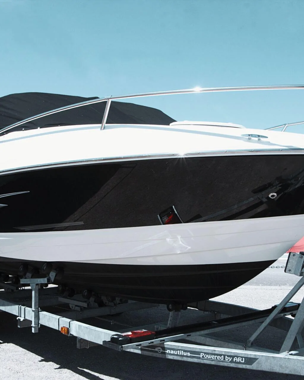 Ceramic-protected glossy boat hull on a trailer