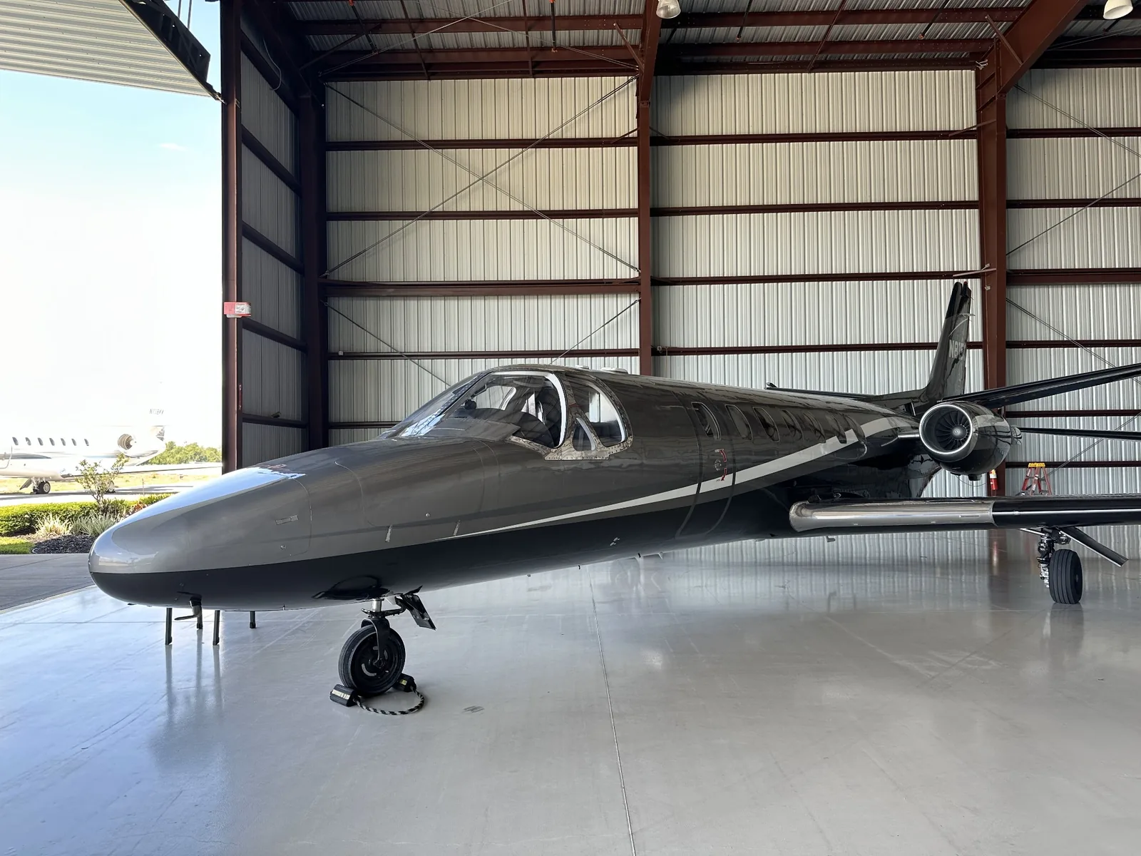 Business jet parked in a hangar during low-moisture cleaning service