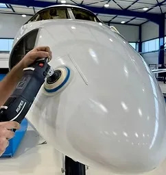 Aircraft nose being polished by hand