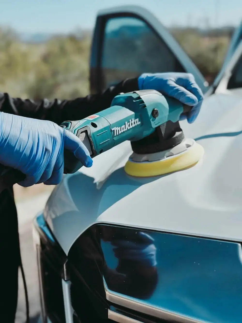 Machine polishing a vehicle panel in Scottsdale, Arizona