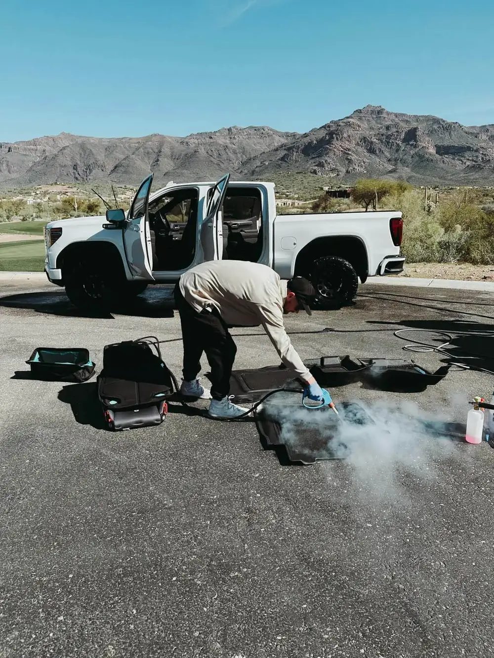 Technician steam cleaning a truck in Scottsdale, Arizona