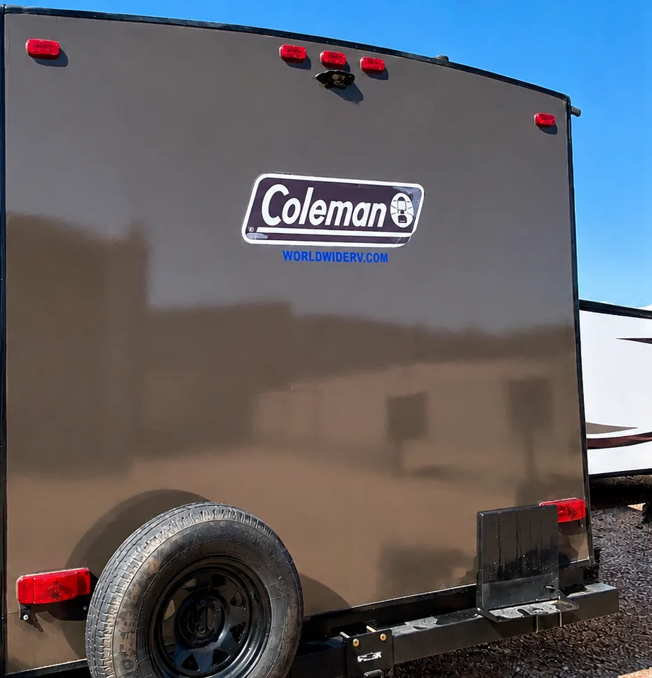 Restored glossy fiberglass rear cap on a Coleman travel trailer after gel coat restoration