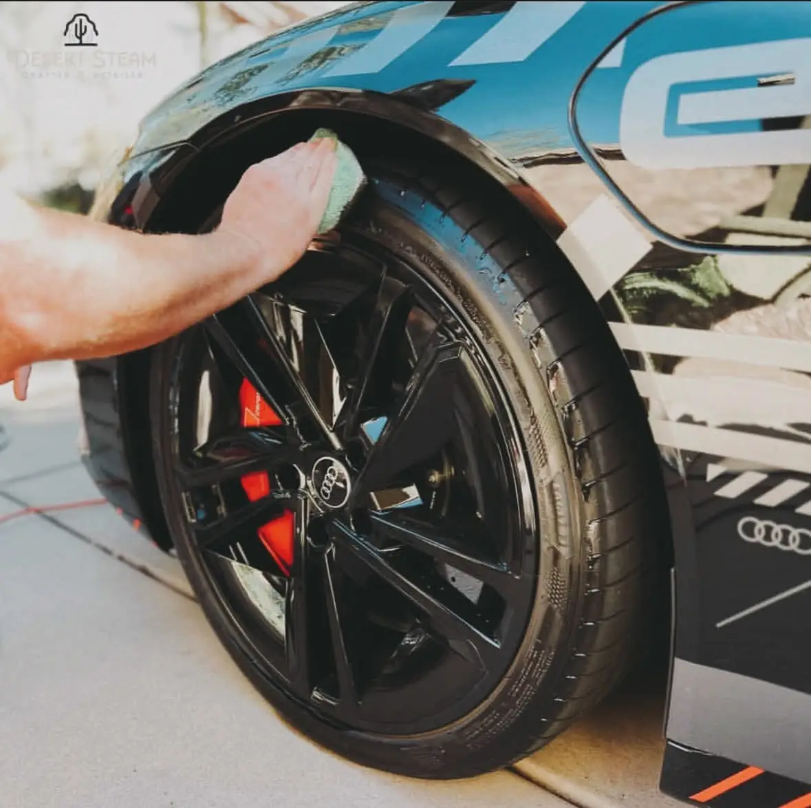 Steam cleaning a wheel and brake caliper in Scottsdale