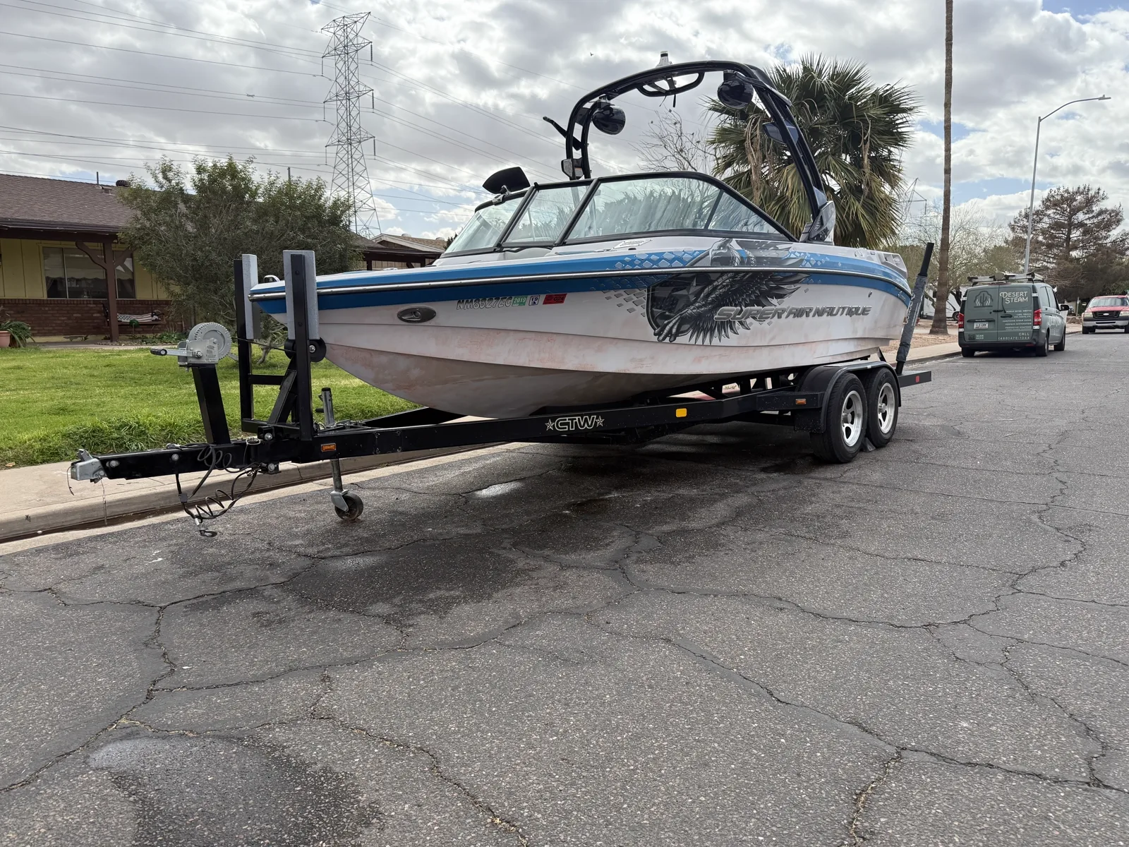 Ski boat on a trailer being evaluated by the Desert Steam Detail mobile team in Arizona